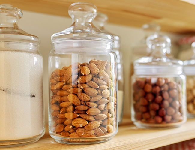 Almonds in jars on shelves
