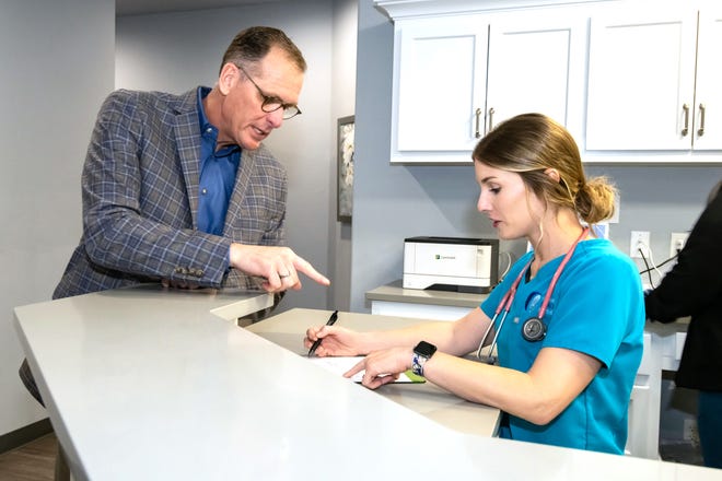 Dr. Kyle Rickner and nurse Emily Stroup are pictured at Primary Health Partners' Edmond clinic