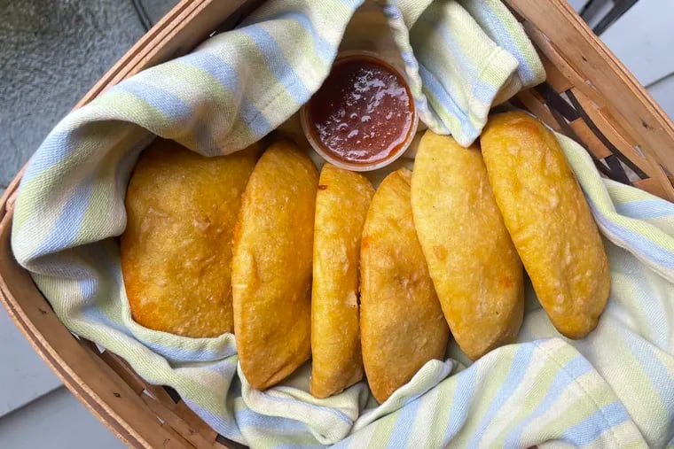 An assortment of hot empanadas  from Sazon 2 Go, a Venezuelan stand at local farm markets that represents a tasty comeback for the owners of a longstanding restaurant that closed during the pandemic.